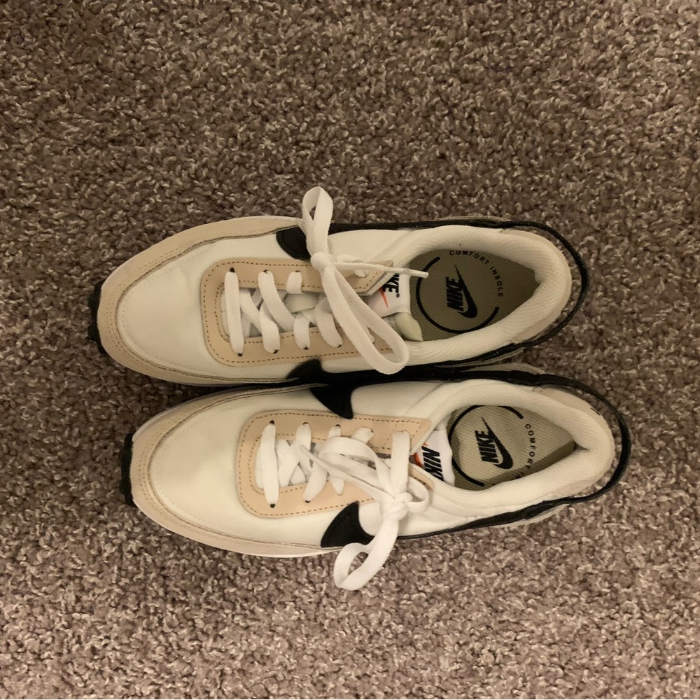 Tan and black Nike shoes